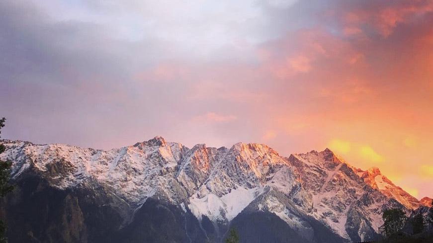 gorgeous pink sunset over glacial mountains